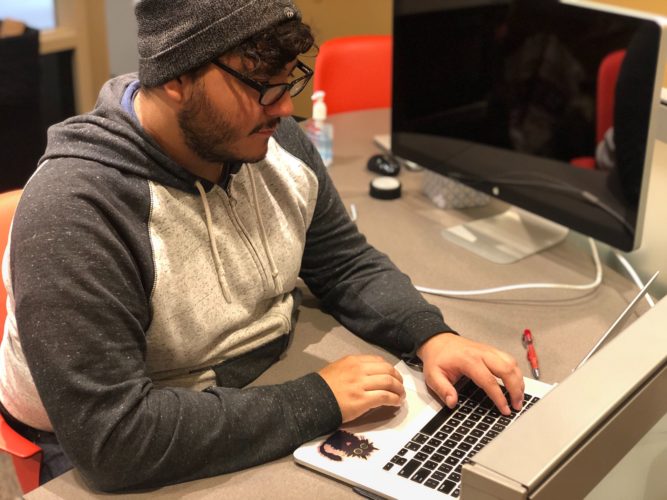 Eric Chavarria works on code.